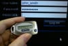 A physical token displays a one-time passcode to connect to an online accoun